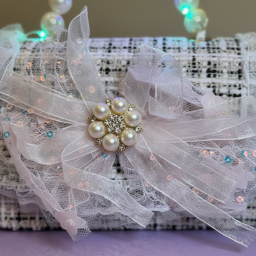 Close-up of pearl bow detail