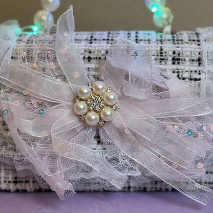 Close-up of pearl bow detail